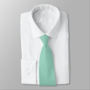 A soft mint muted solid color. neck tie