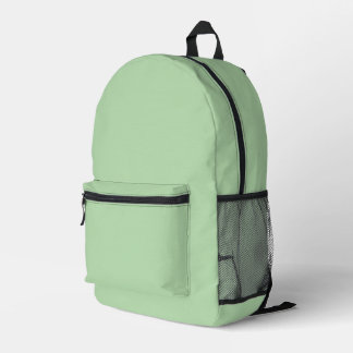 A soft pale green background fills the image printed backpack
