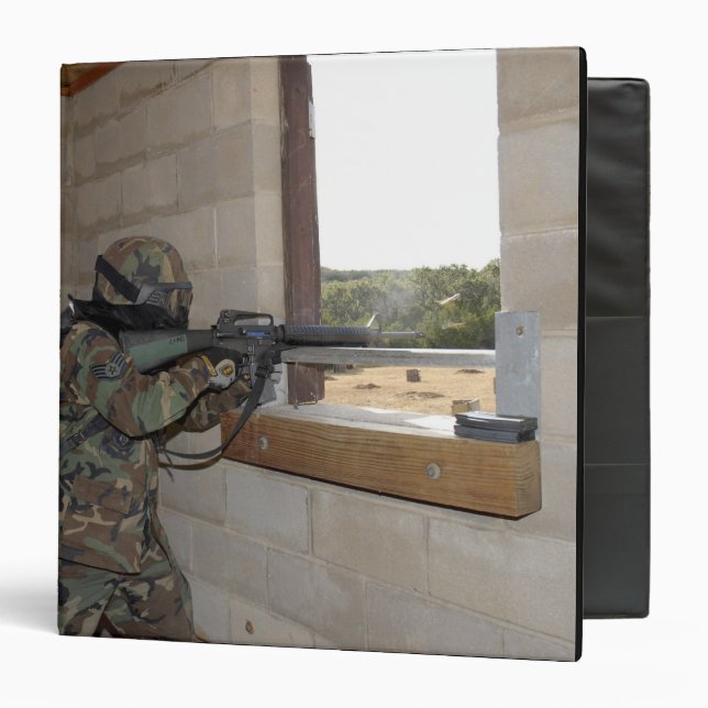 A soldier acts as an opposition force 3 ring binder (Front/Inside)