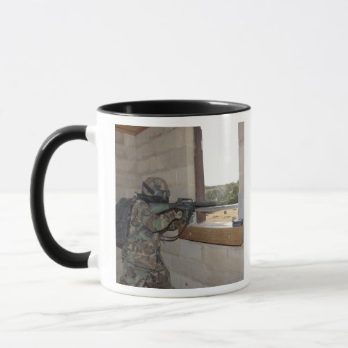 A soldier acts as an opposition force mug