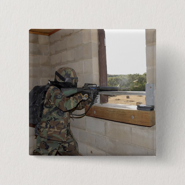 A soldier acts as an opposition force pinback button (Front)