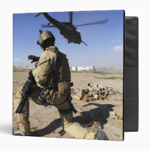 A soldier conducts security for an HH-60 Binder