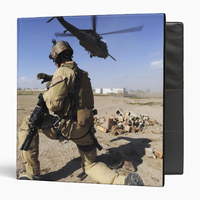 A soldier conducts security for an HH-60 Binder (Front/Inside)