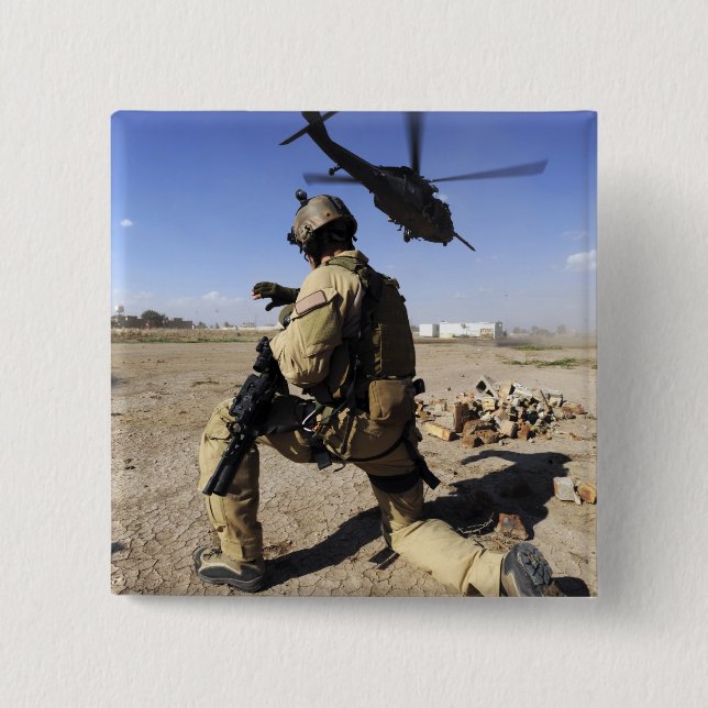 A soldier conducts security for an HH-60 Button (Front)