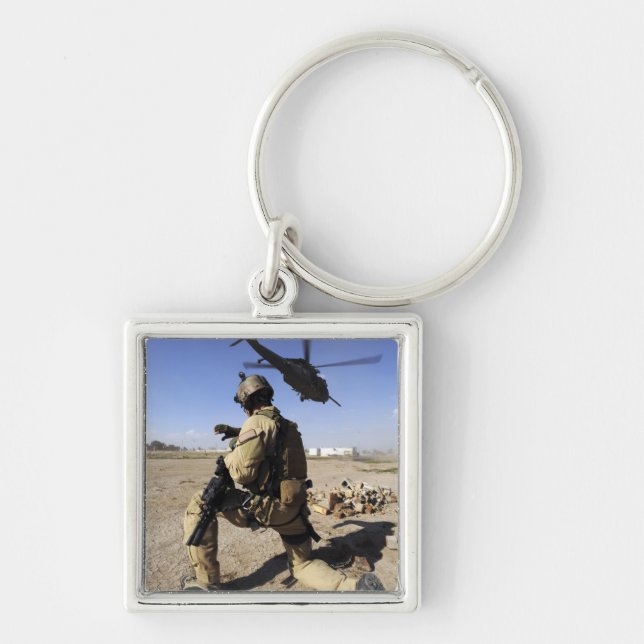 A soldier conducts security for an HH-60 Keychain (Front)