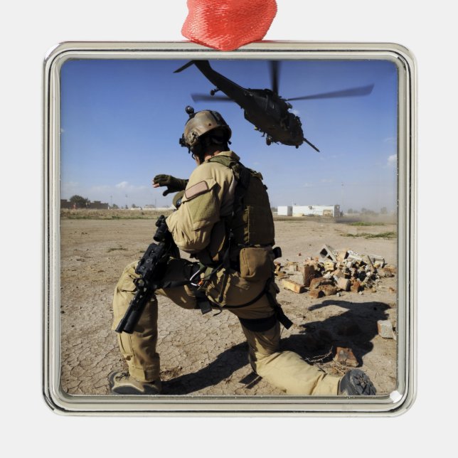 A soldier conducts security for an HH-60 Metal Ornament (Front)