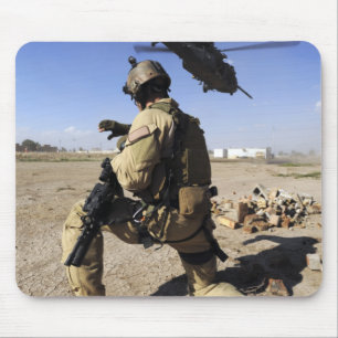 A soldier conducts security for an HH-60 Mouse Pad