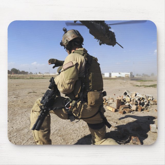 A soldier conducts security for an HH-60 Mouse Pad (Front)