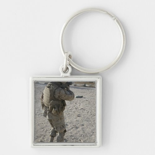 A soldier engages his target on a shooting rang keychain