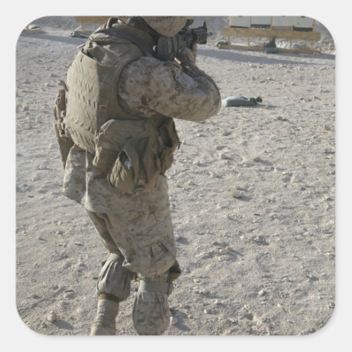 A soldier engages his target on a shooting rang square sticker