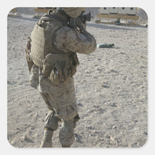 A soldier engages his target on a shooting rang square sticker