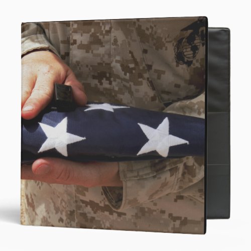 A soldier holds the United States flag Binder