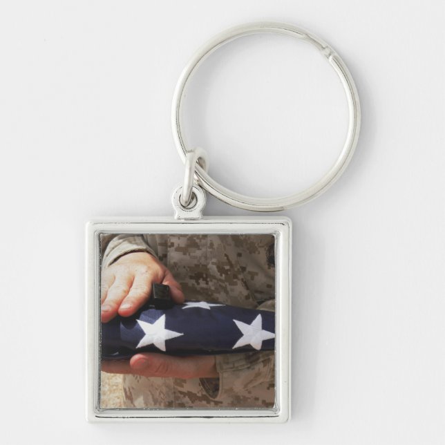 A soldier holds the United States flag Keychain (Front)