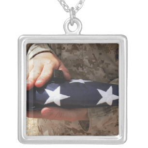 A soldier holds the United States flag Silver Plated Necklace