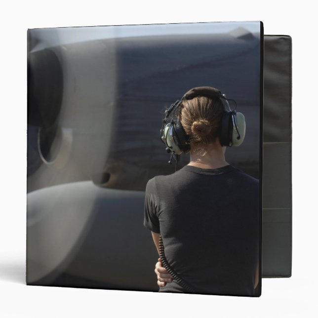 A soldier monitors the performance binder (Front/Inside)