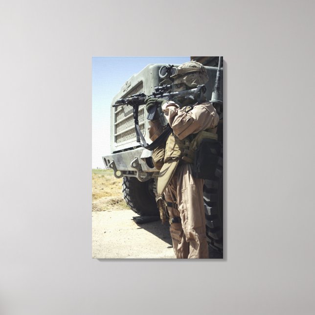 A soldier provides security for Marines Canvas Print (Front)