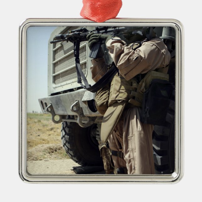 A soldier provides security for Marines Metal Ornament (Front)
