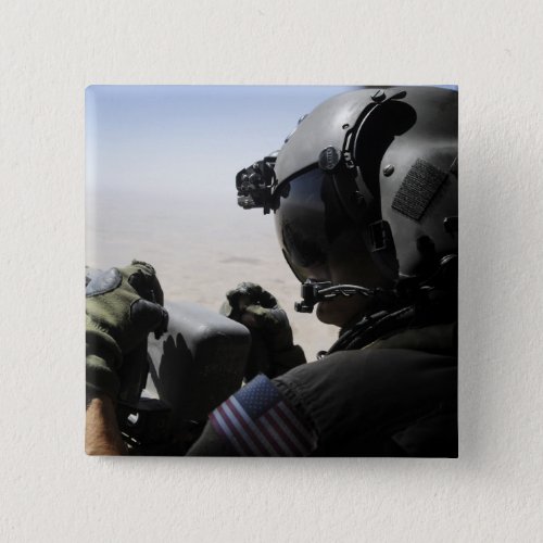 A soldier provides security pinback button