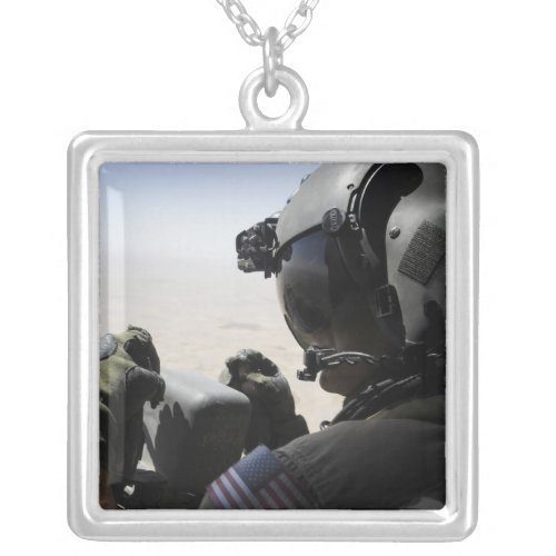 A soldier provides security silver plated necklace