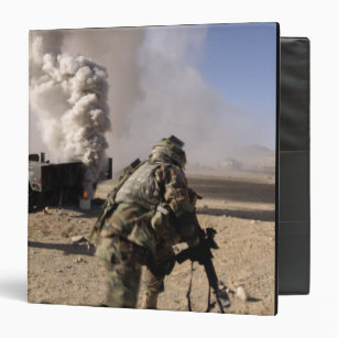 A Soldier reacts to a controlled explos Binder