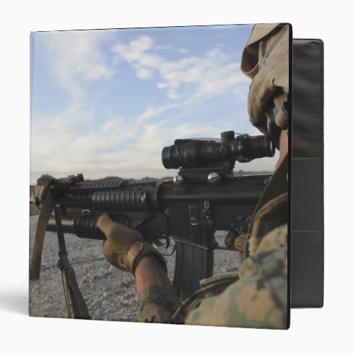 A soldier sights in to fire on a target 3 ring binder