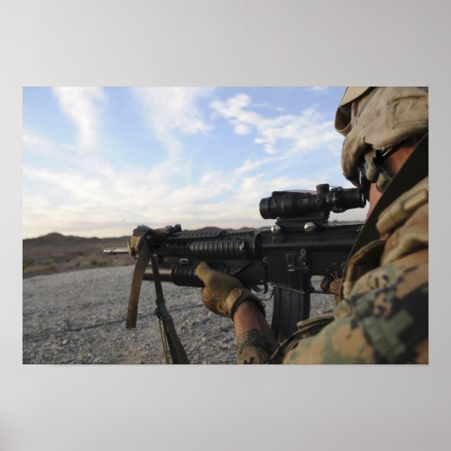 A soldier sights in to fire on a target poster