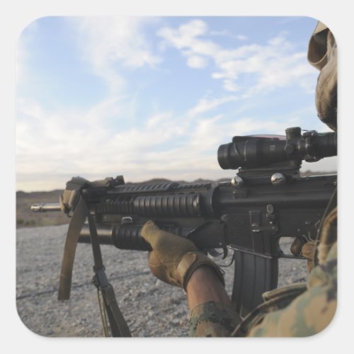 A soldier sights in to fire on a target square sticker