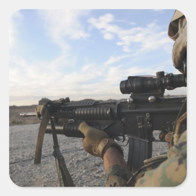 A soldier sights in to fire on a target square sticker (Front)