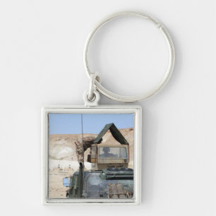 A soldiier instructs an Iraqi army soldier Keychain