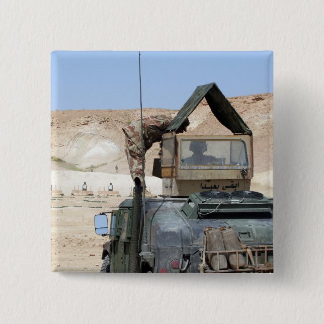 A soldiier instructs an Iraqi army soldier Pinback Button (Front)