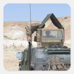 A soldiier instructs an Iraqi army soldier Square Sticker