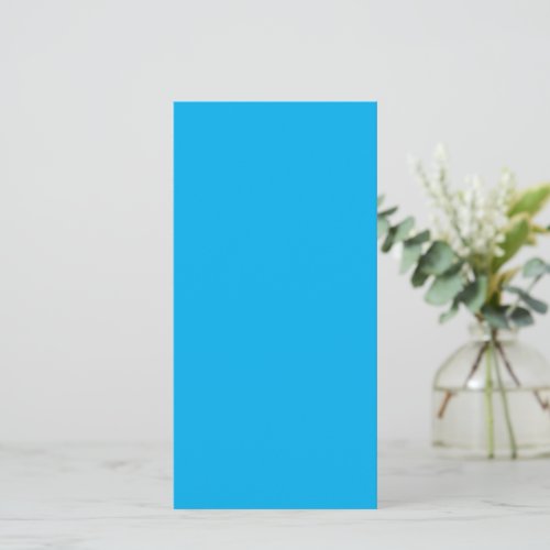 A solid bright blue background fills  card