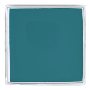 A solid teal color fills the entire image silver finish lapel pin
