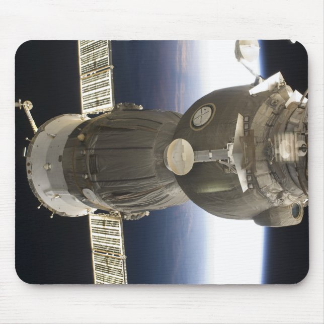 A Soyuz spacecraft backdropped by Earth Mouse Pad (Front)