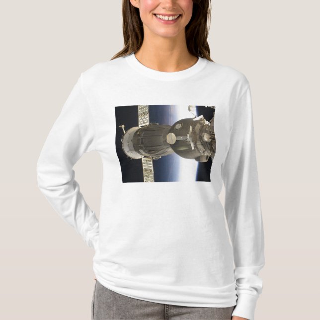 A Soyuz spacecraft backdropped by Earth T-Shirt (Front)