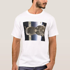 A Soyuz spacecraft backdropped by Earth T-Shirt