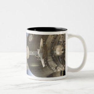A Soyuz spacecraft backdropped by Earth Two-Tone Coffee Mug