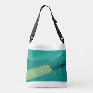 a springboard to dive into the pool crossbody bag