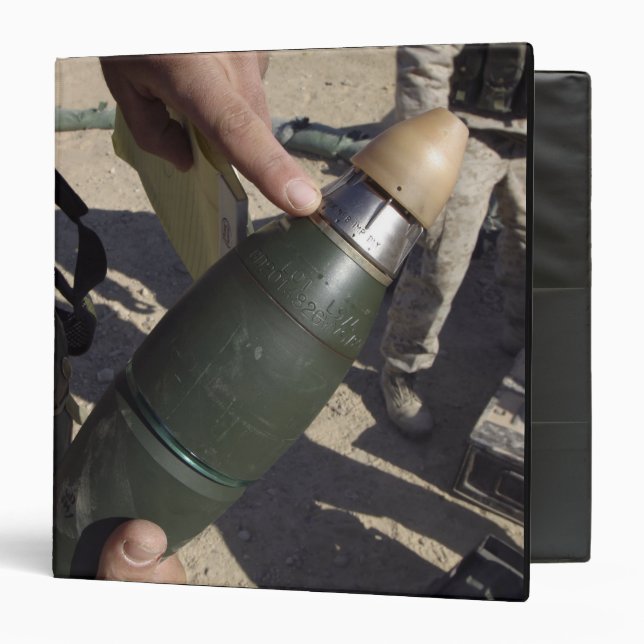A squad leader points to a delay setting binder (Front/Inside)