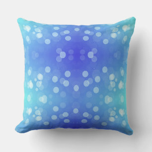 A square pillow with a gradient design from blue