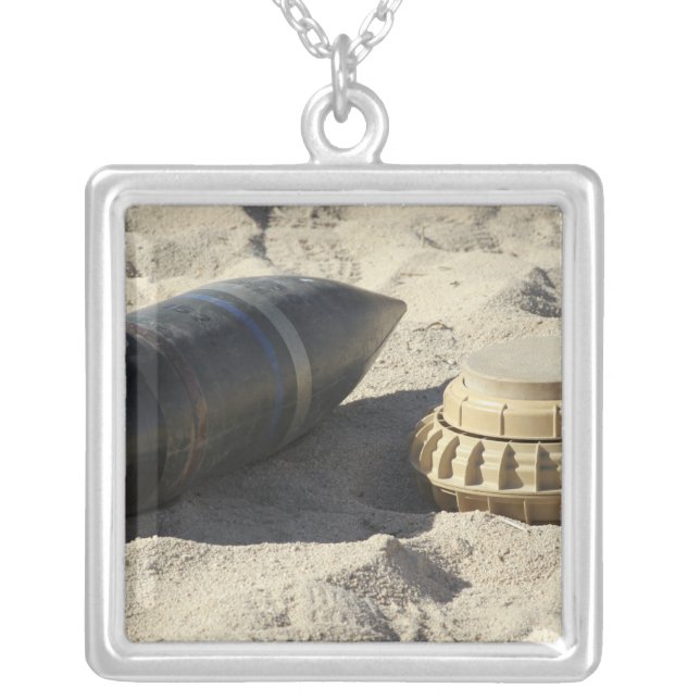 A static display of a converted ordnance shell silver plated necklace (Front)