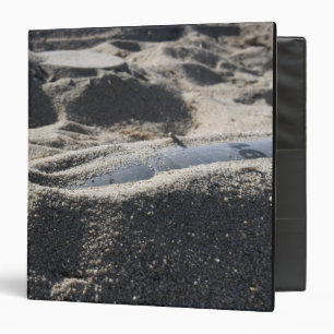 A static display of an ordnance shell 3 ring binder