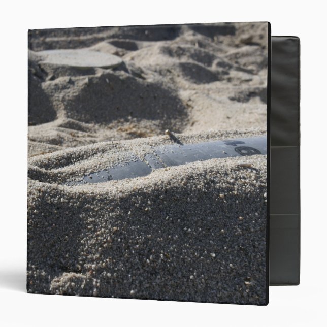 A static display of an ordnance shell 3 ring binder (Front/Inside)