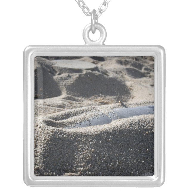 A static display of an ordnance shell silver plated necklace (Front)