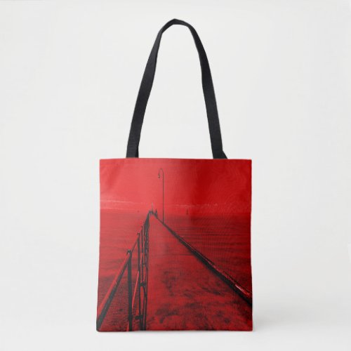 A stroll along the pier at the seaside  tote bag