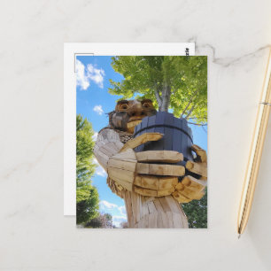 A Surreal Troll Holds Up a Tree Postcard