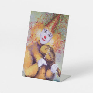 A sweet clown playing the violin pedestal sign