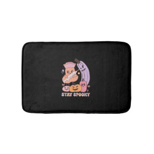 A Sweet Smile Under the Bold Costume The Halloween Bath Mat