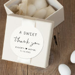 A Sweet Thank You Cream Wedding Classic Round Sticker<br><div class="desc">Chic light cream thank you sticker for your wedding reception favors featuring "A Sweet Thank You" in simple modern typography and a stylish script,  your names joined together by a heart and your wedding date.</div>