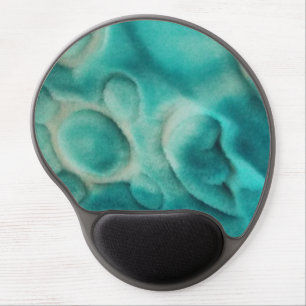 A swirling pattern in teal and light beige gel mouse pad